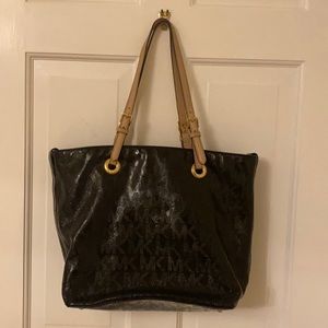 Michael Kors shiny black tote with tan straps
